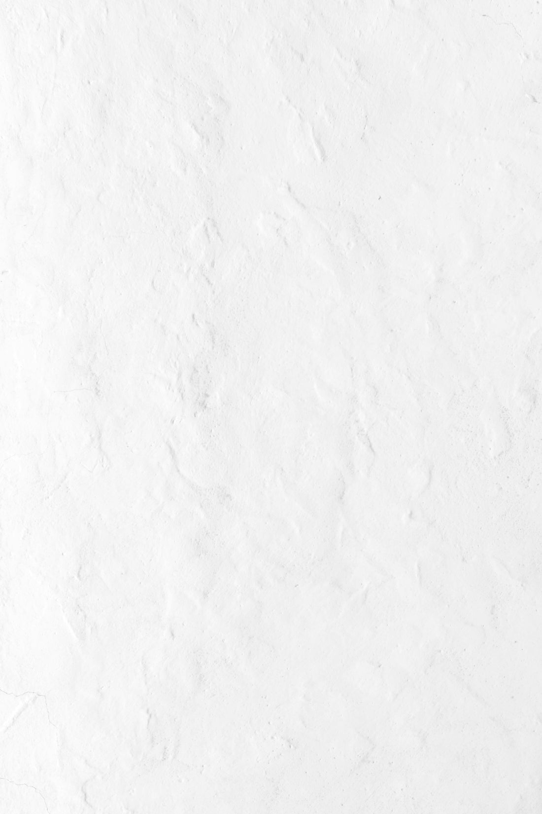 a person riding a snowboard down a snow covered slope