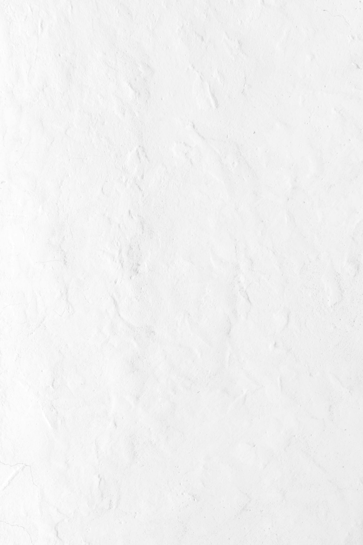 a person riding a snowboard down a snow covered slope