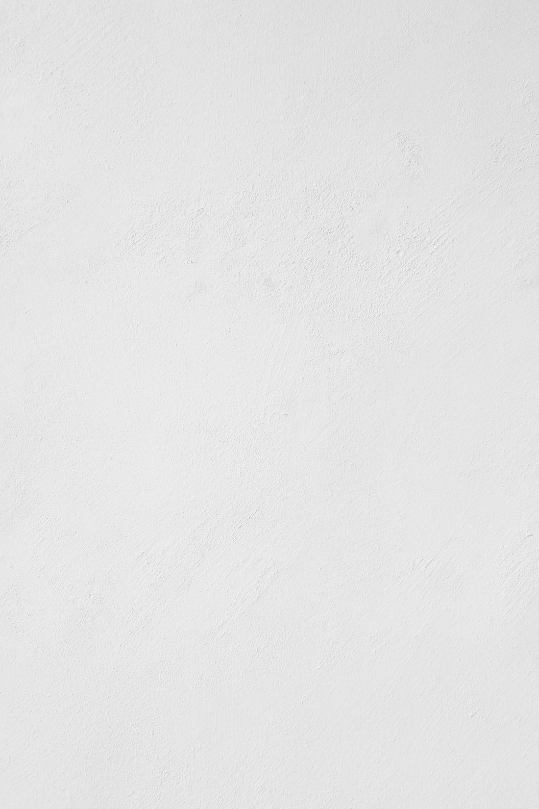 a man riding a snowboard down a snow covered slope