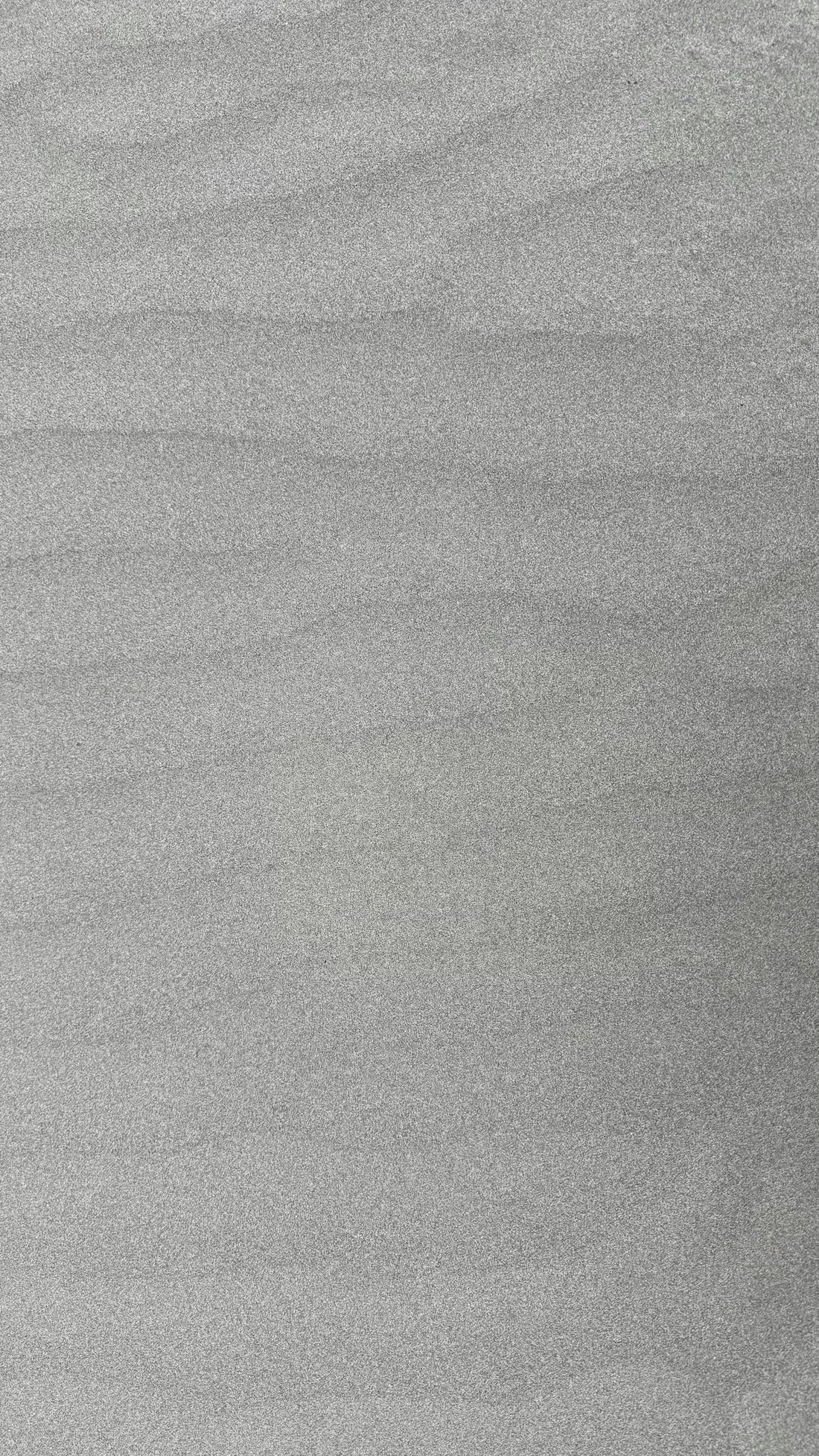 A man riding a snowboard down a snow covered slope